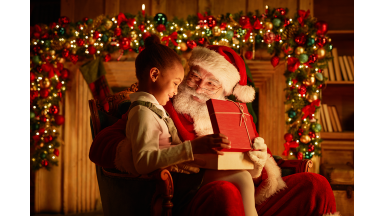 Cute Little Girl With Santa On Christmas