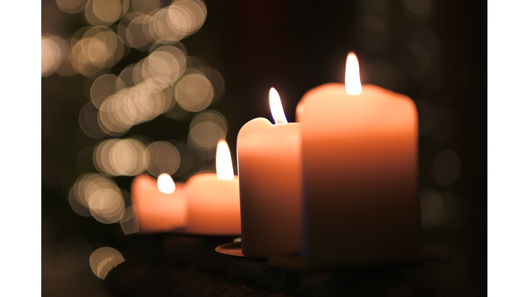 Close-up of illuminated candles on table,Germany