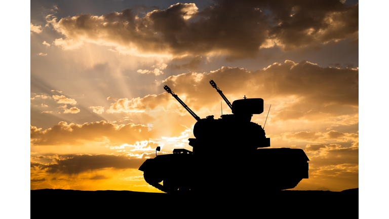 Self-propelled anti-aircraft gun at sunset