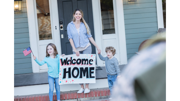 Family greets dad upon return home from military assignment