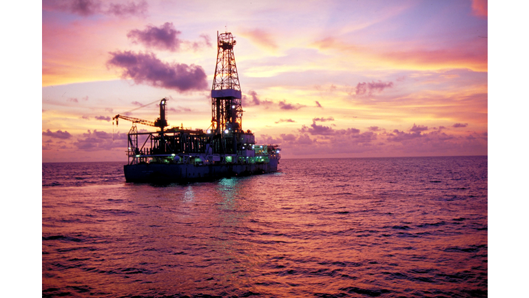 Offshore drilling rig at sunset in the Gulf of Mexico