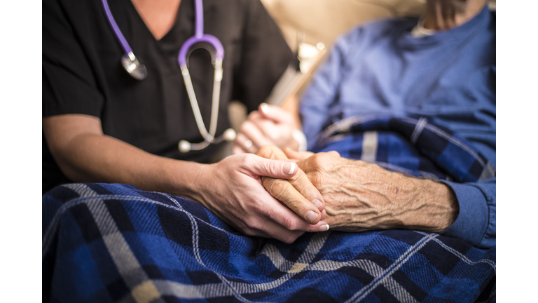 Hospice Nurse visiting an elderly male patient