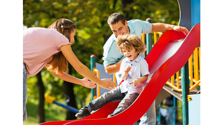 Playful family in the playground.