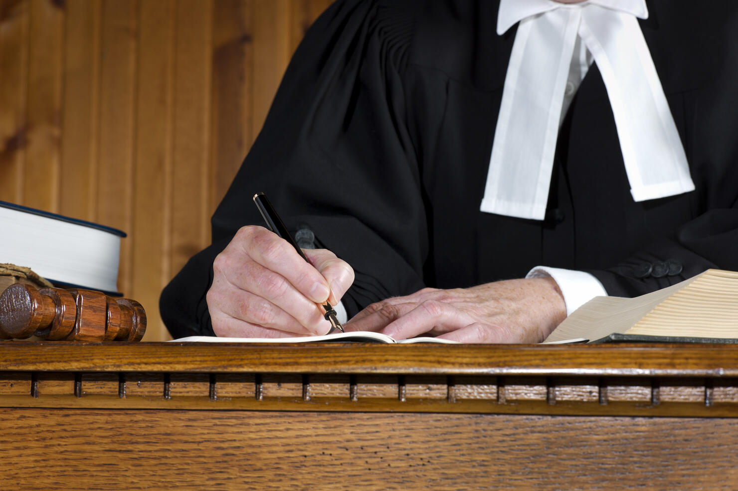 Judge in robes Taking Notes.