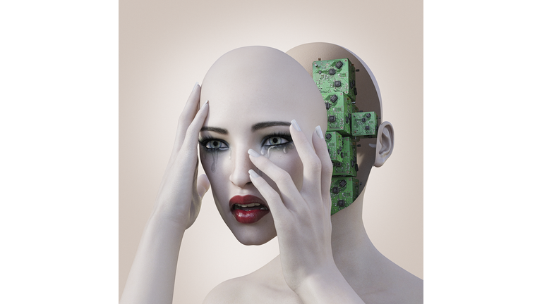 Robot woman holding removable face mask revealing circuits