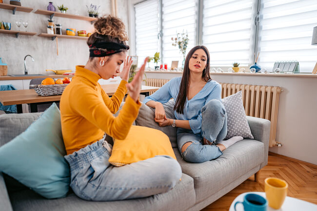 Two Young Women Arguing At Home