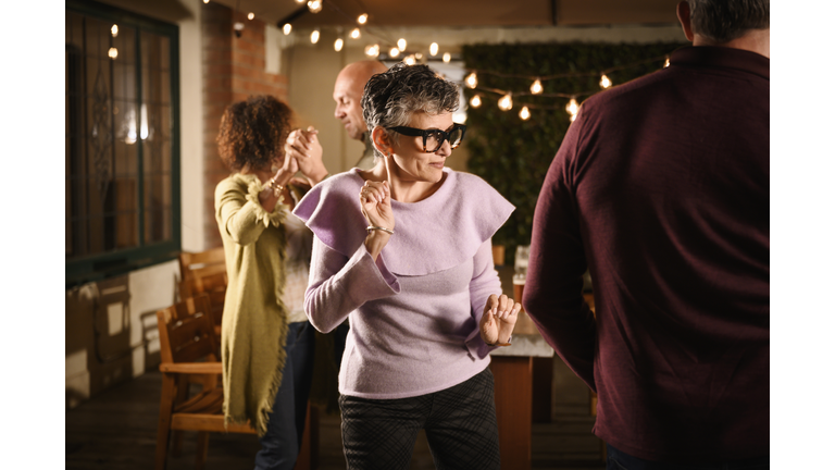 Senior couple dancing at outdoor party