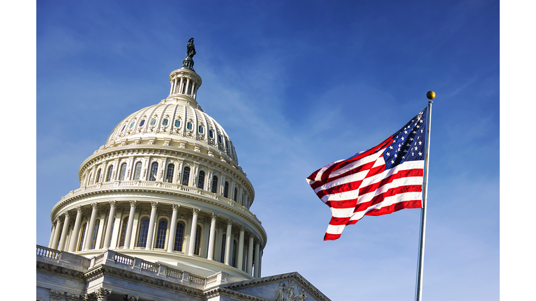 American flag waving with the Capitol Hill
