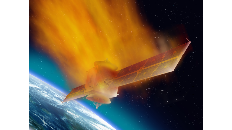 Satellite burning as it returns from space