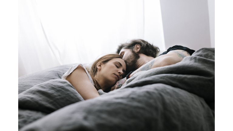 Couple sleeping in Bed together