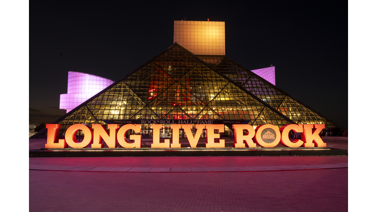 Rock & Roll Hall Of Fame Lit In CARE Colors For International Day Of The Girl