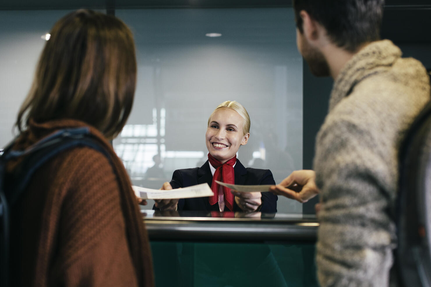 Young Traveller Couple At Check-In Counter
