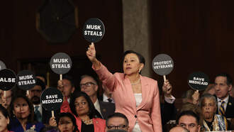 Progressive Lawmakers Hold Up Protest Signs During President Trump's Speech