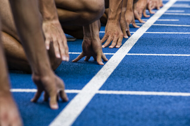 Track sprinters lined up at starting