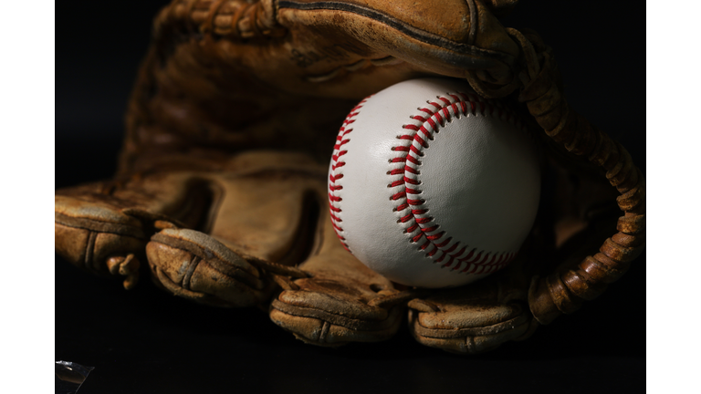 Glove and baseball on a black background, no background people are excellent.