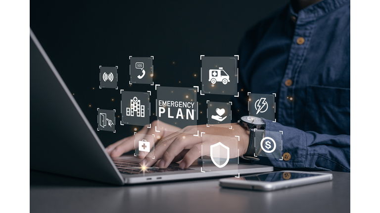 Businessman using a computer to Emergency Plan icon to learn and prepare in emergency situation .Business Evacuation Training concept. Concept of Emergency Preparedness Plan