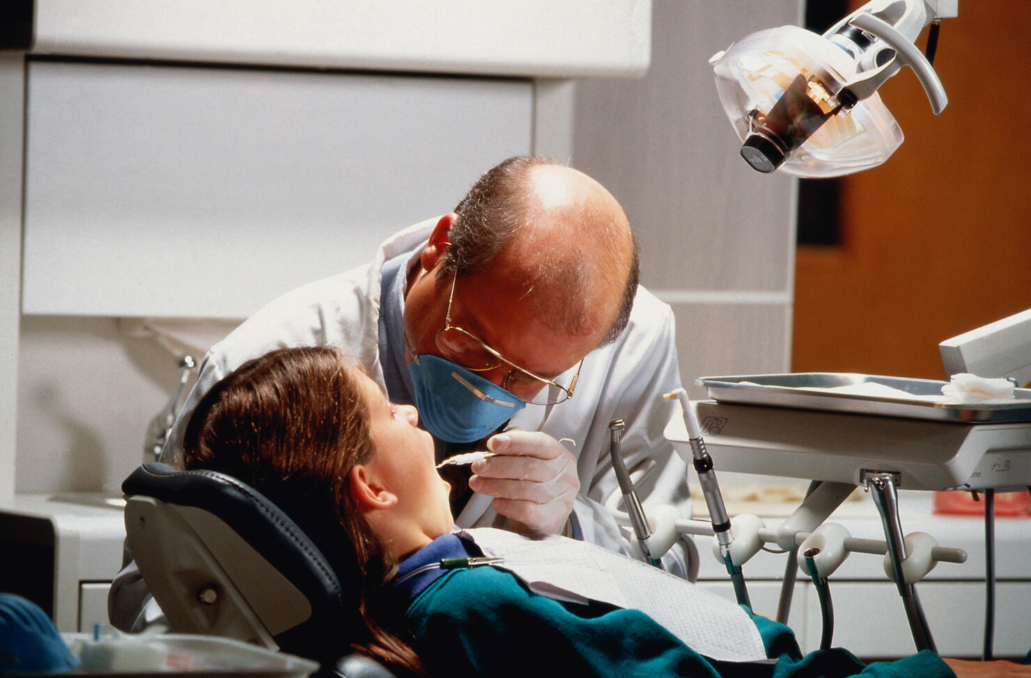 Dentist treating young girl (7-9)