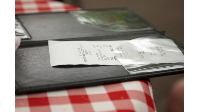 Restaurant check on patterned cloth