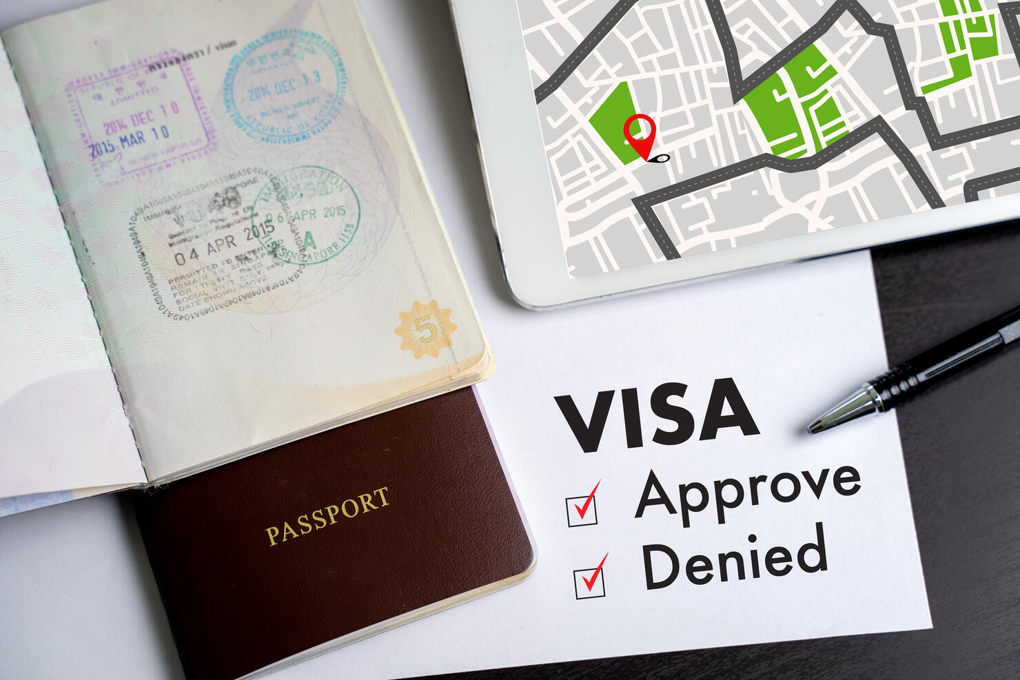 Visa and passport to approved stamped on a document top view in Immigration Visa approve