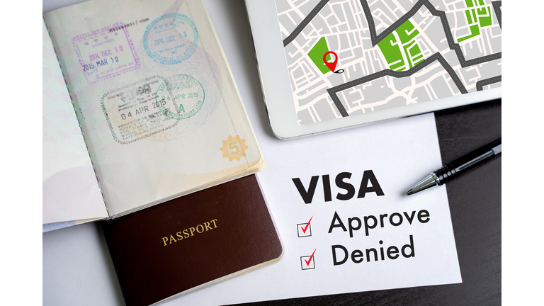 Visa and passport to approved stamped on a document top view in Immigration Visa approve
