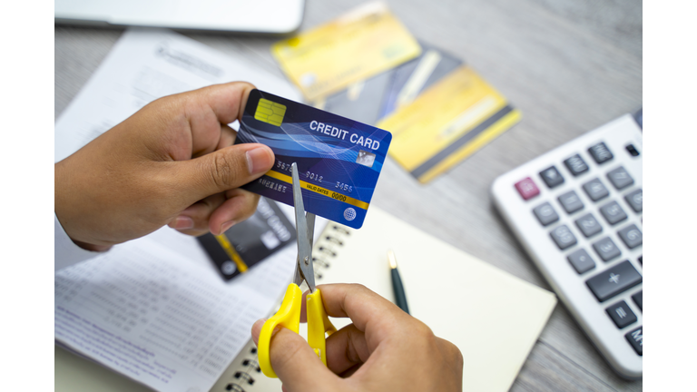 Scissors cutting a credit card