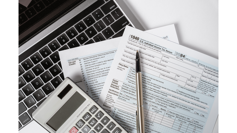 1040 Tax Form with Laptop and Calculator