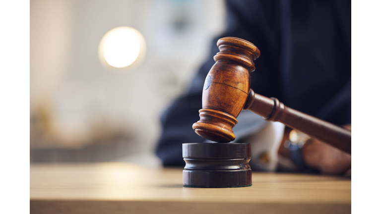 Law, judge and closeup of lawyer with gavel for justice, court hearing and legal trial for magistrate. Government, attorney career and zoom of desk for investigation, criminal case and verdict order
