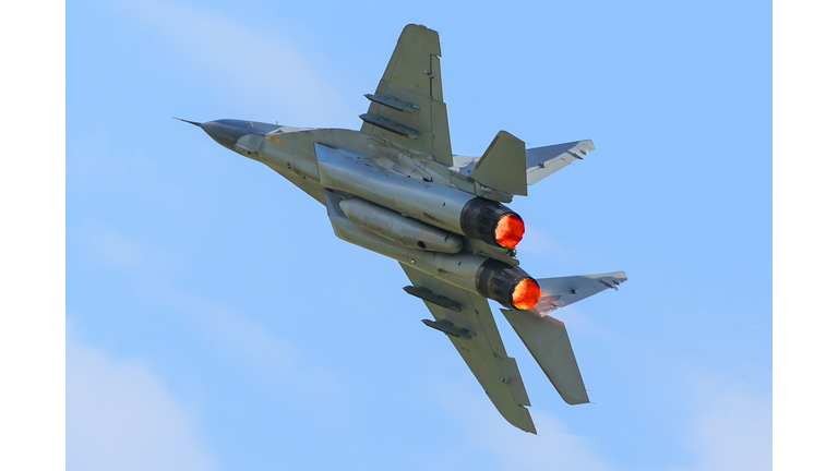 Fighter aircraft with afterburner in the sky (MIG 29)