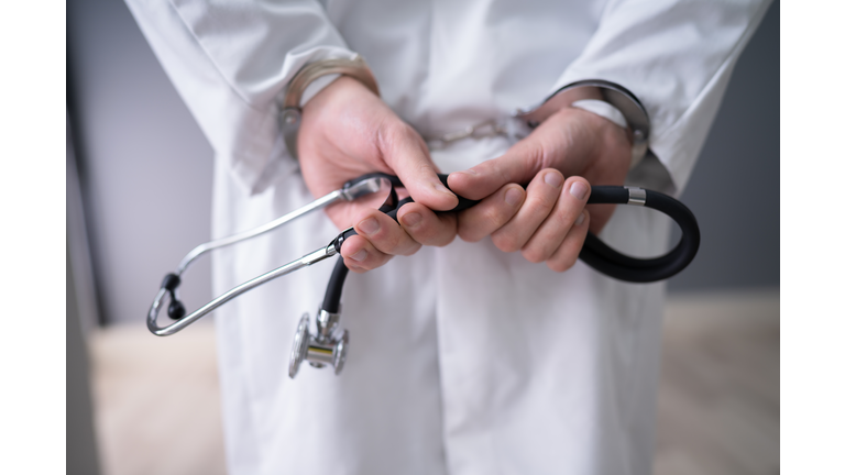 Doctor Hands In Handcuffs
