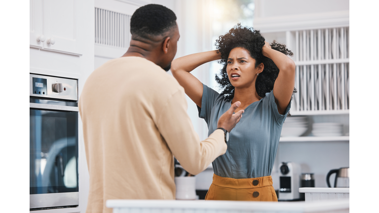 Stress, divorce and couple fighting in a kitchen with anxiety, debt or erectile dysfunction at home. Marriage, doubt and man with woman in a house for conflict, argue or liar, cheating or infertility