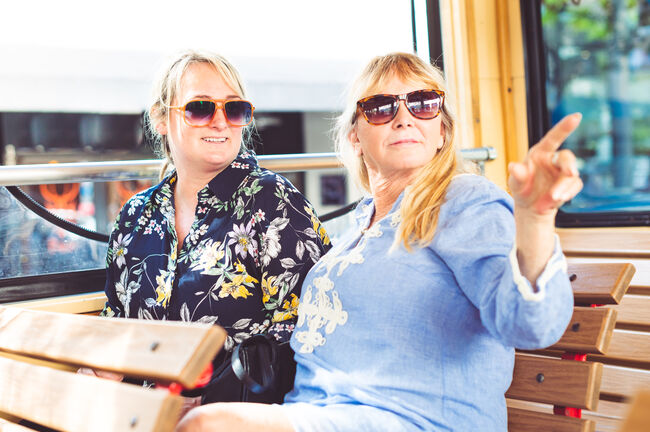 Two women, mother and adult daughter enjoying a tour on a vacation together