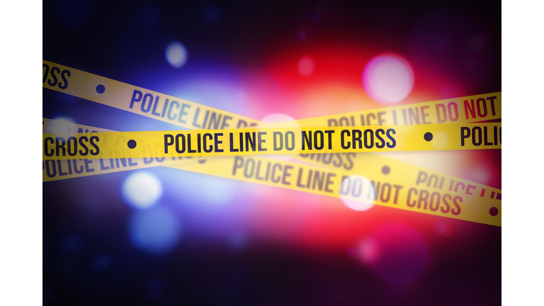 Glowing bokeh Police lights blur with Yellow tape showing typography do not cross, alert concept background. Police, legal, inquiry, warning concept