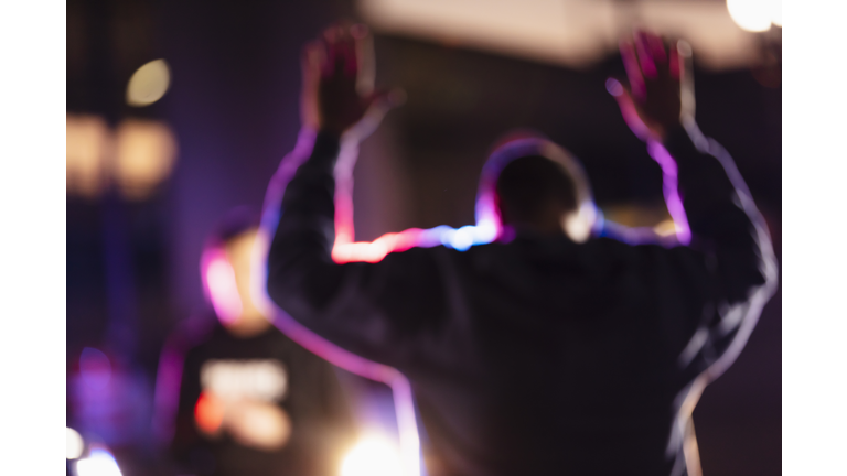 Man surrendering to police at night