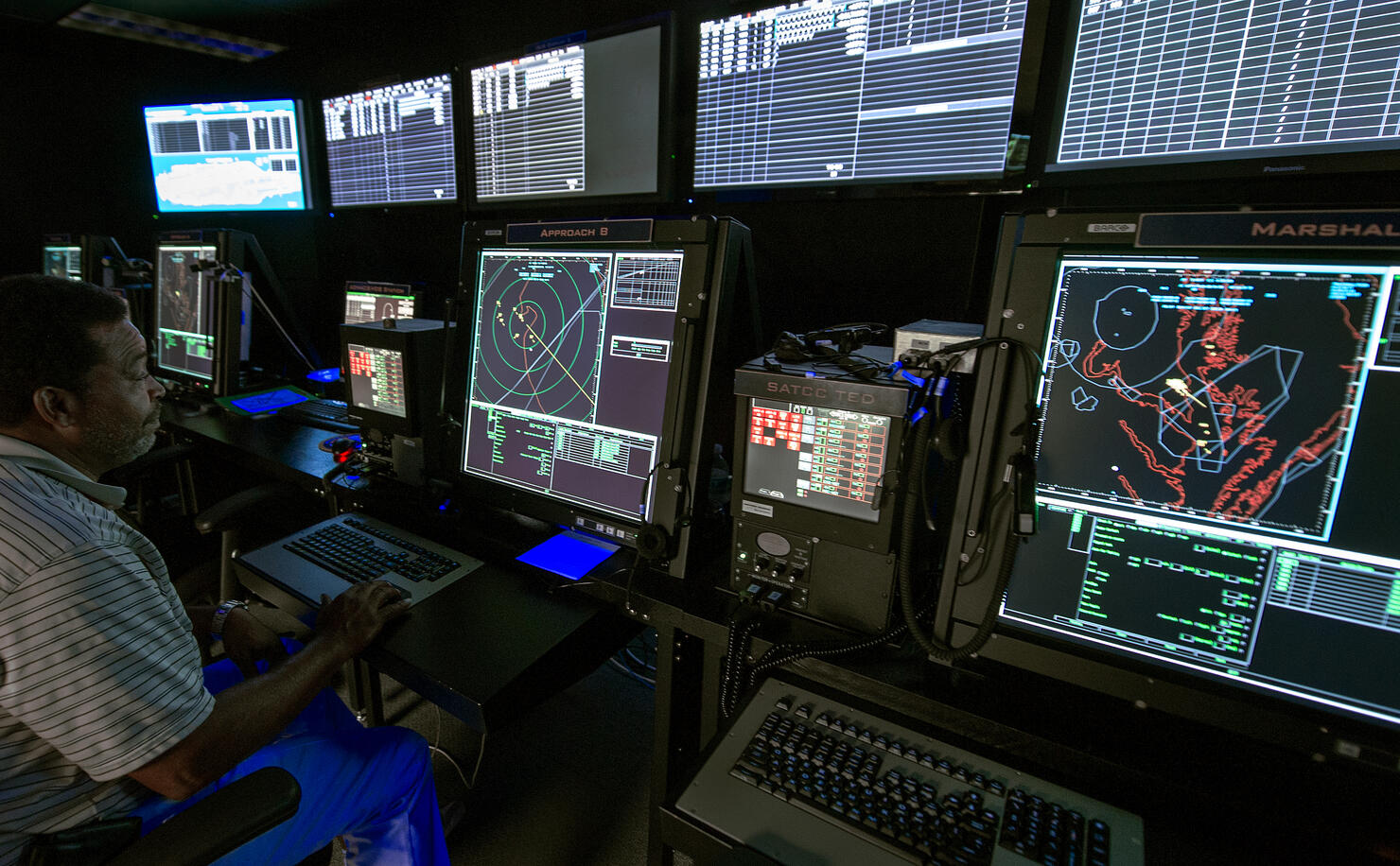 An Air Traffic Controller monitors compu