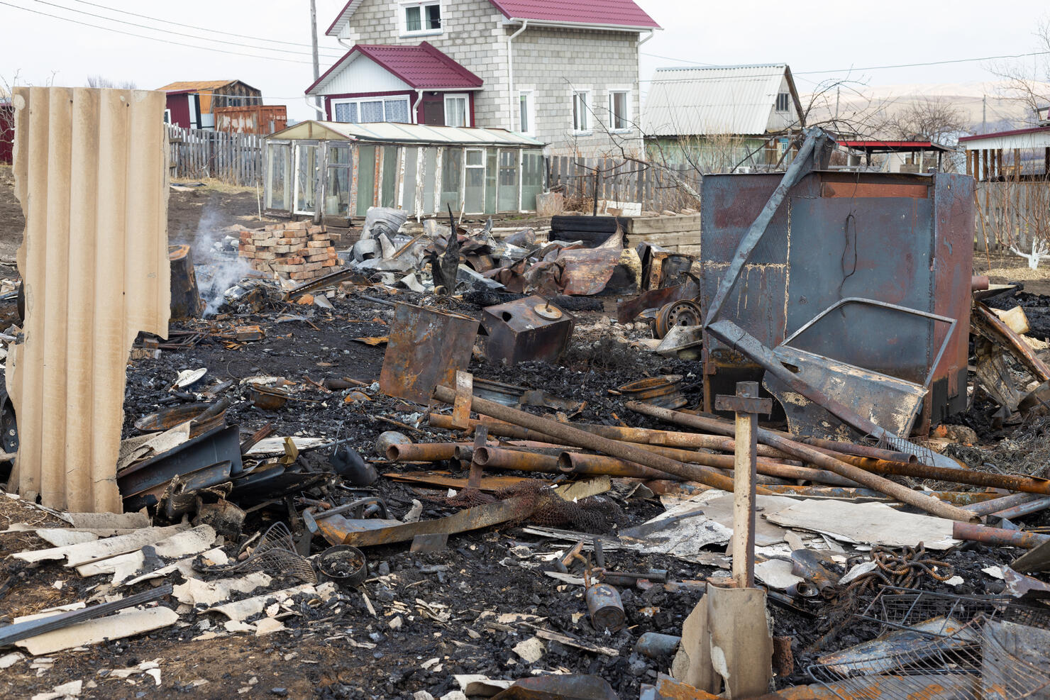 Remains of a burned down house after fire