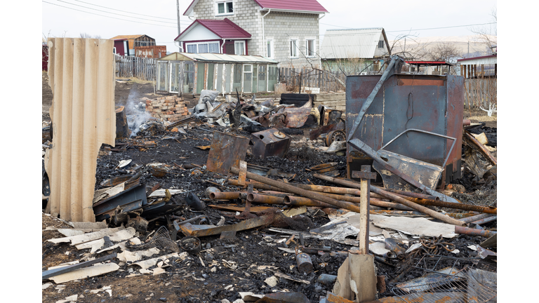 Remains of a burned down house after fire