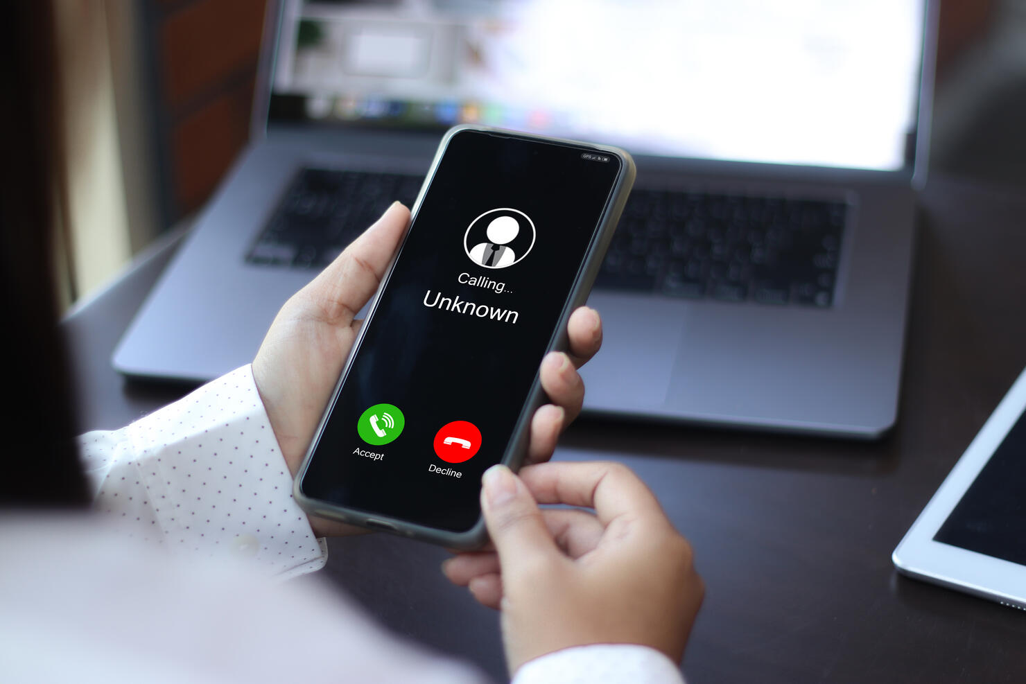 Unknown number displayed showing on smart mobile phone. Human use smartphone with incoming call from unknown number, spam, hacker, call center, crime,