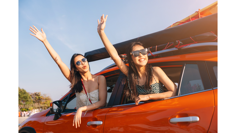 Young women head out while enjoying a summer road trip