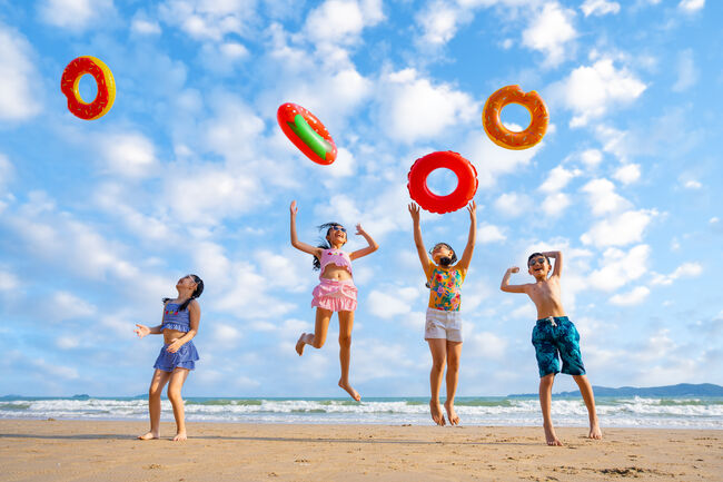 Playful children playing on the beach