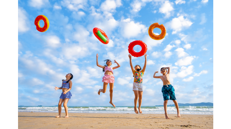 Playful children playing on the beach