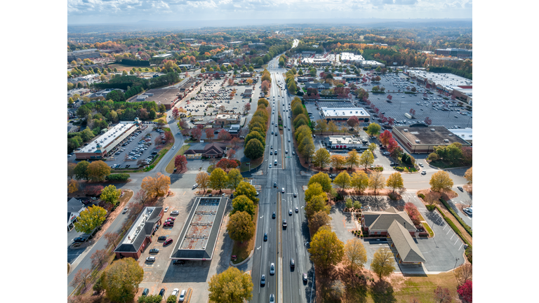 Aerial view Atlanta suburbs next to Peachtree Parkway during the Fall