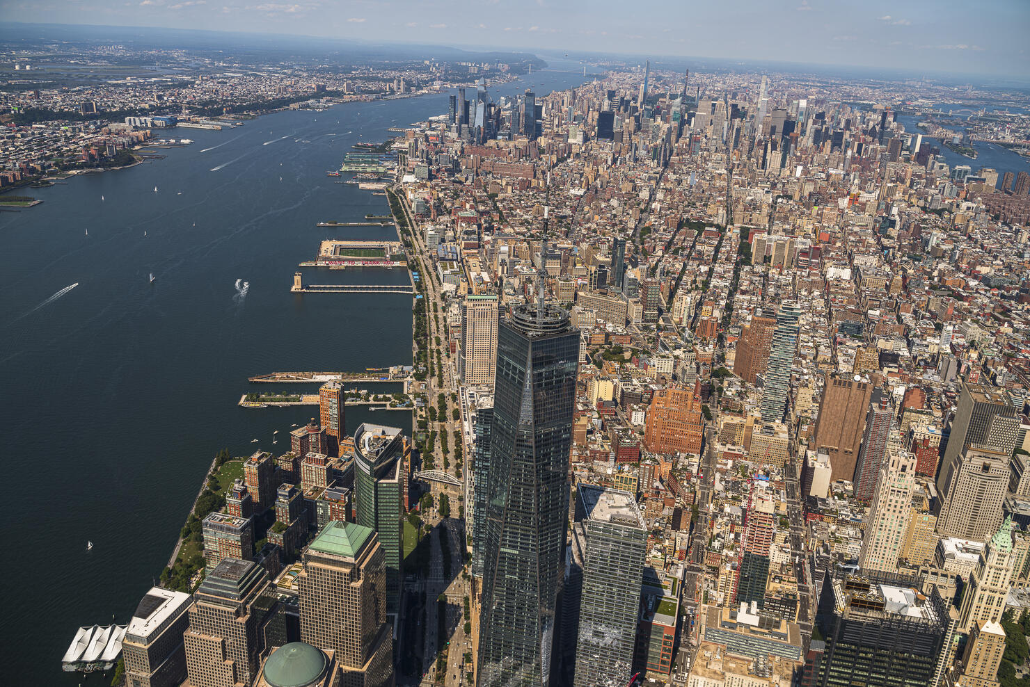 Aerial panorama of Manhattan Skyline from Downtown, over Freedom Tower, toward Midtown and Upper Manhattan, Harlem, and The Bronx.