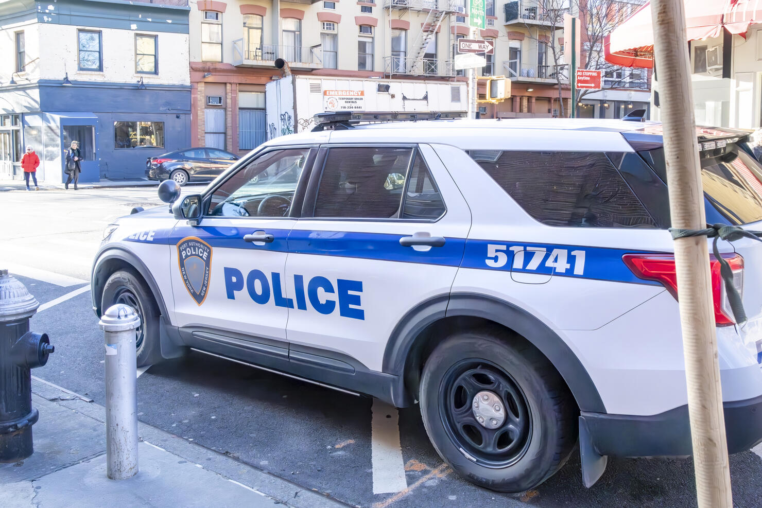NYPD patrol car at the side of the road on Christopher Street