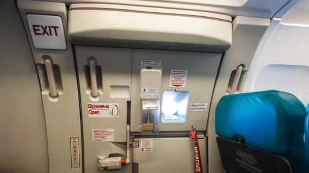 Marine Tackles 'Unruly' Passenger Who Tired To Open Exit Door Midflight