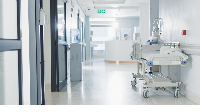 Hospital, healthcare and medical with an empty corridor for wellness, care or treatment and disease control. Medicine, service and hallway of a lobby in a clinic for rehabilitation or recovery