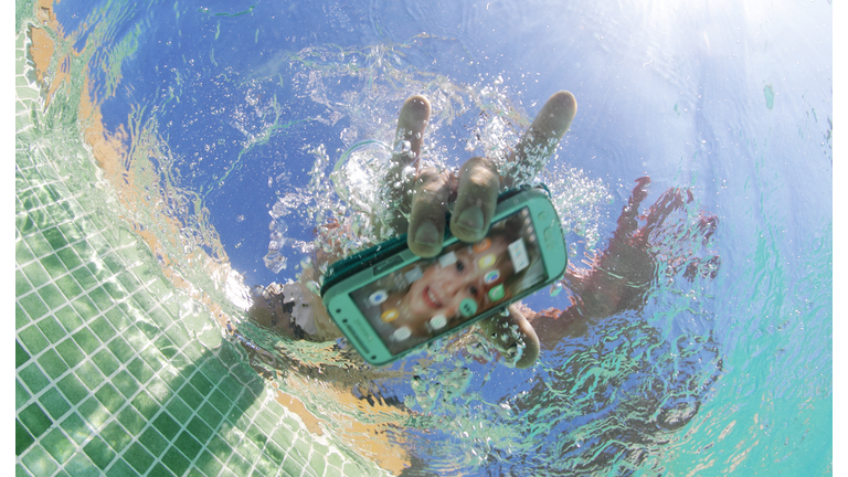 dropping mobile phone in pool
