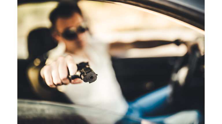At a gunpoint