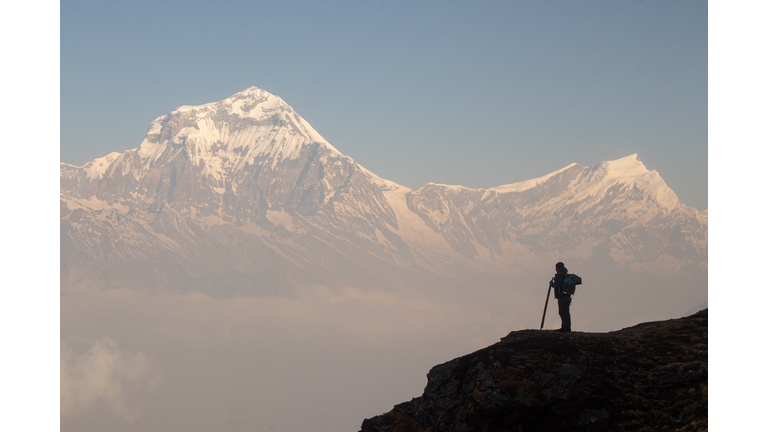 Man hiking on a mountain in Nepal, morning daylight