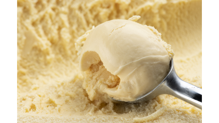 Scoop the vanilla ice cream with an ice cream scoop.