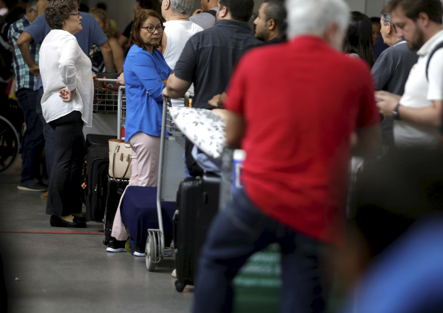 passengers in airport boarding area